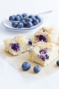 Close up of blueberry buttermilk tray bake cake with coconut