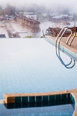 Swimming pool and Mon bridge at dawn vertical