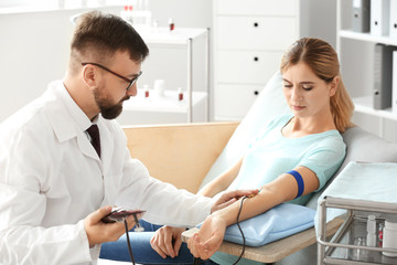 Woman donating blood in hospital