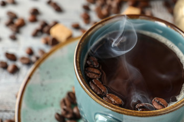 Cup of hot tasty coffee, closeup