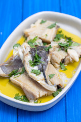 boiled cod fish with herbs and olive oil