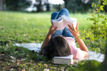 Woman reading a book in the garden.