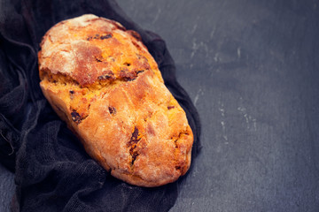 cornbread with chourico on black ceramic background