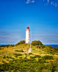 Fototapeta na wymiar Classic view of the famous Lighthouse Dornbusch on the beautiful island Hiddensee in summer, Baltic Sea, Mecklenburg-Vorpommern, Germany