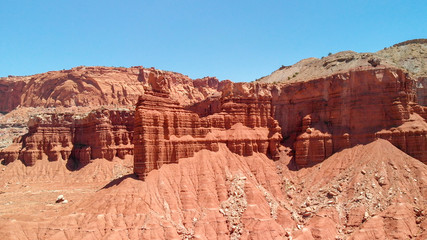 Fototapeta premium Amazing aerial view of beautiful red canyon and mountains