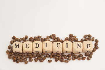 Alphabet cubes with cannabis seeds on white background medicine