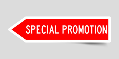 Sticker in red color arrow shape with word special promotion on gray background