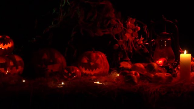 Carved halloween pumpkins and candles glow in the dark