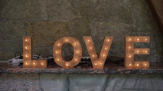 Wording wooden Love sign with light bulb