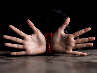 Kidnapped little girl tied with rope.Abused and tortured concept. Human trafficking concept. Stop...