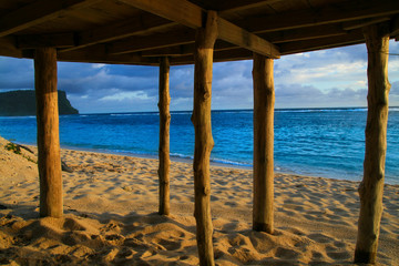 Deep blue waters of Pacific Ocean wiev through wooden pillars of beach fale - traditional Samoan house Lalomanu beach Samoa, Polynesia