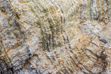 fragment of the stone cave mountain at the sea