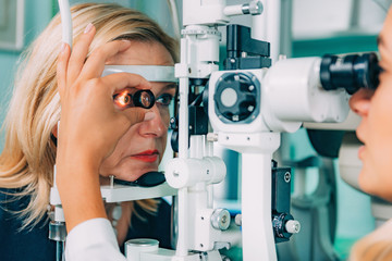 Ophthalmology. Examination With Magnifying Glass - obrazy, fototapety, plakaty