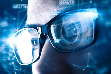 The abstract image of the businessman wear a smart glasses overlay with futuristic hologram. The...