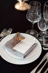 Sparkling glassware stands on table prepared for wedding. Wedding decor, interior. Festive. Banquet table. - 229761857