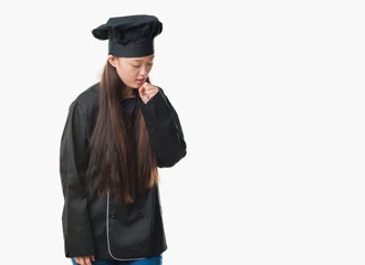 Young Chinese woman over isolated background wearing chef uniform feeling unwell and coughing as symptom for cold or bronchitis. Healthcare concept.