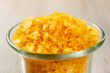Spa nature products. Glass bowl with yellow sea salt for bathroom