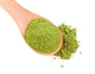 matcha green tea in Wooden spoon with powder