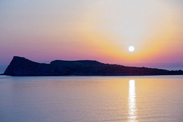 Sunrise on the beach, early morning in Kolokitha island, Crete, Greece