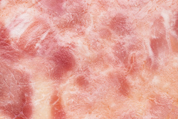 Close-up fragment of ham meat as a background texture composition
