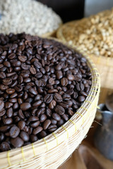 Many coffee grains on rough fabric,.Roasted coffee beans on sacking