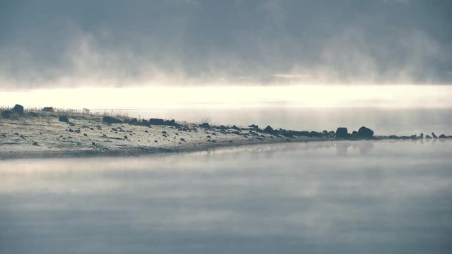 FOG OVER THE WATER IN THE MORNING