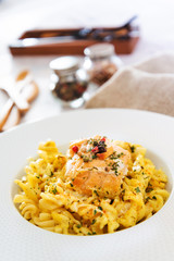 tasty pasta with salmon on a the table