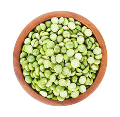 Green split peas in bowl on white background