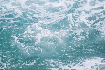 Sea Waves in ocean wave Splashing Ripple Water. Blue water background.	