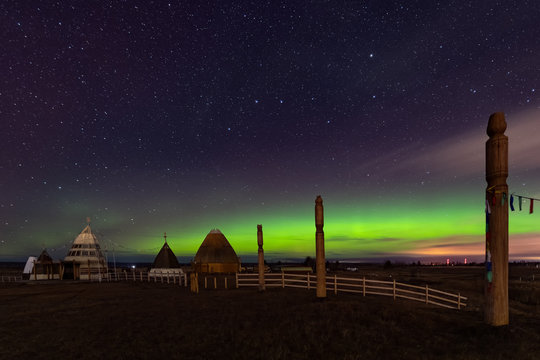 Aurora display in Yakutsk. The polar Northern lights aurora borealis sky star in Yakutia, Siberia, in place of the cult summer festivity Yhyakh Tuymaady of Yakuts, of the people of Yakutia