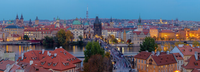 Fototapeta na wymiar Prague - The panorama of the city with the Charles bridge on Olt Town at dusk.