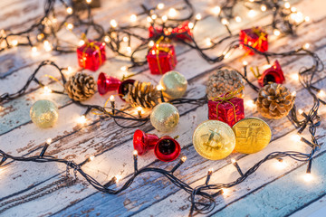 Golden bitcoin and another bitcoin in back with christmas decorations and lights