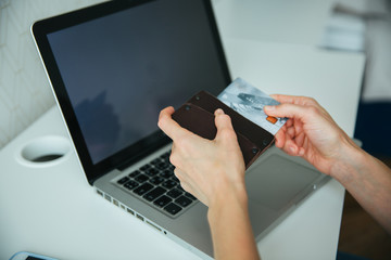 Online payment,woman's hands holding a credit card and using smart phone for online shopping