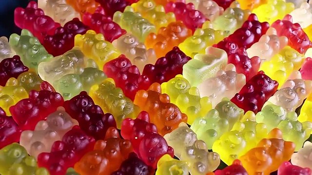 Gummy bear colorful candy rotating texture pattern closeup footage