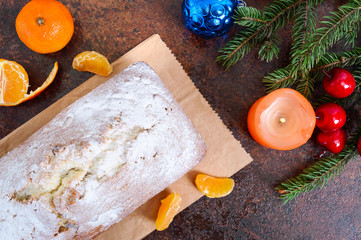 Christmas cake with nuts, dried fruit, tangerines. Traditional festive pastries.