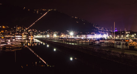 the incredible light show of Como, reflected in the dark waters of the Lake. Italy