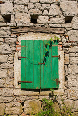 A shuttered window in the historic village of Robidisce in Primorska, western Slovenia
