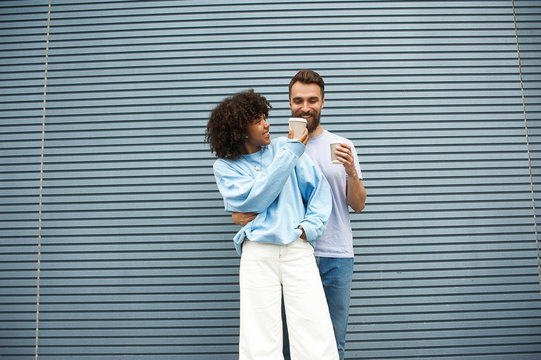 Portrait of beautiful girl and a caucasian hipster guy