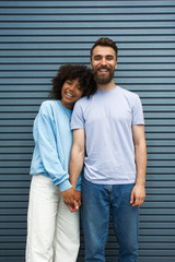 Beautiful girl and caucasian hipster guy in urban setting