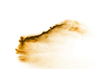 Dry river sand explosion. Golden colored sand splash against  white background.