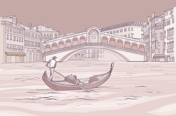 Venetian gondola with gondolier near Realto bridge.