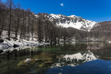 Winter landscape with the Arrenes or Moutsalia alpine lake on Mt Grammos in Greece