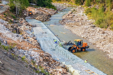 Construction works to protect the riverbank from erosion. Small Inzer River. Southern Urals....