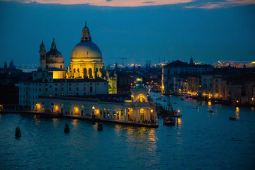 Fototapeta na wymiar Night view of Grand Canal and basilica di santa maria della salute in Venice in Italy