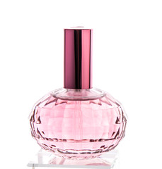 Pink perfume bottle with reflection on white background