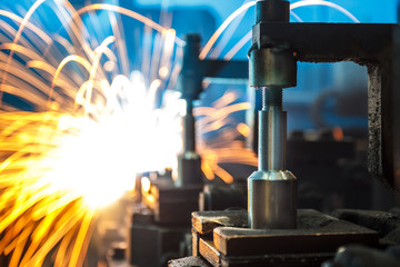 Welding robots movement in a car factory,