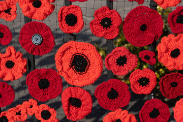 An Impressive Display of Knitted and Crocheted Poppies Pinned to a Metal Fence to Mark the 100th Anniversary of Armistice Day and the End of World War One.