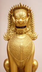 Fototapeta premium Golden lion statue in the thai temple