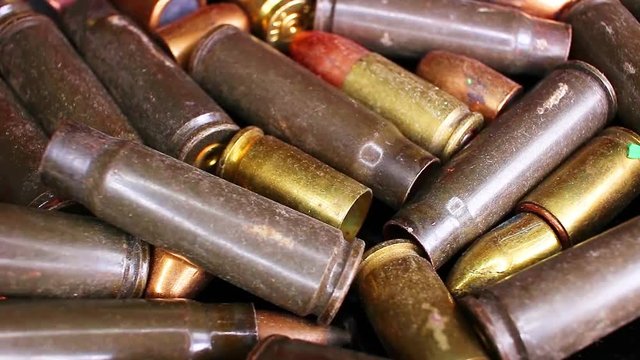 Gun bullets heap bullet war crime gun control concept