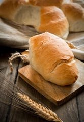 white bread rolls on wooden table